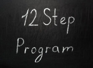 chalkboard writing that says 12 step program