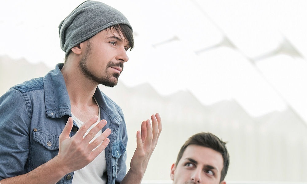 man standing up to talk