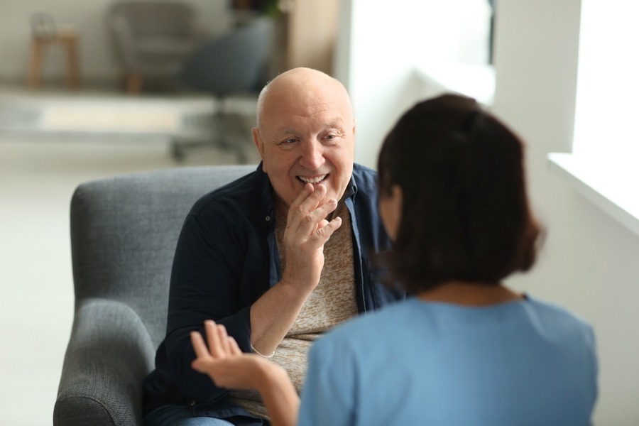 man and woman in individual therapy sitting across from each other